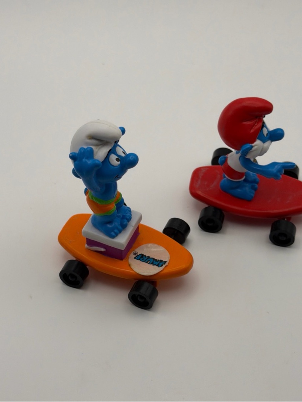 The Smurfs Skateboard Figures - Blue Smurf Characters on Orange & Red Boards